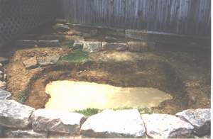 Hole dug for pond and lined with sand