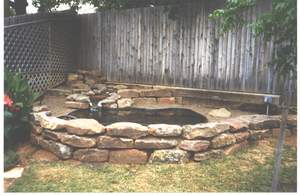 Pond and retaining wall in place & backfilled with dirt